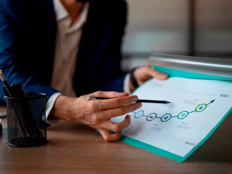 person-office-analyzing-checking-finance-graphs